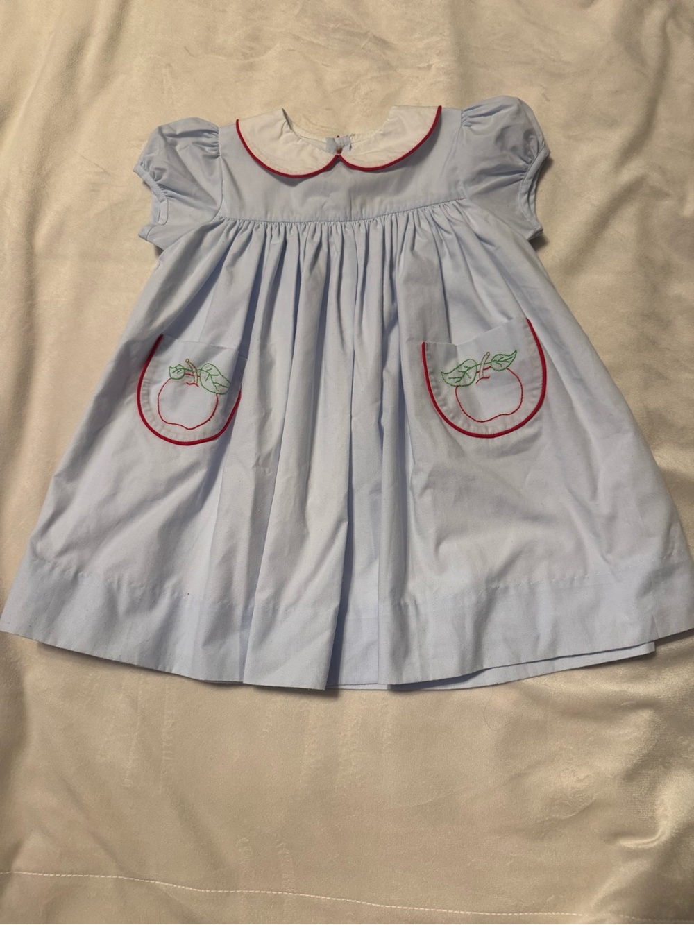 Light Blue Cotton Kids Dress with Red Trim and Apple Pocket Detail